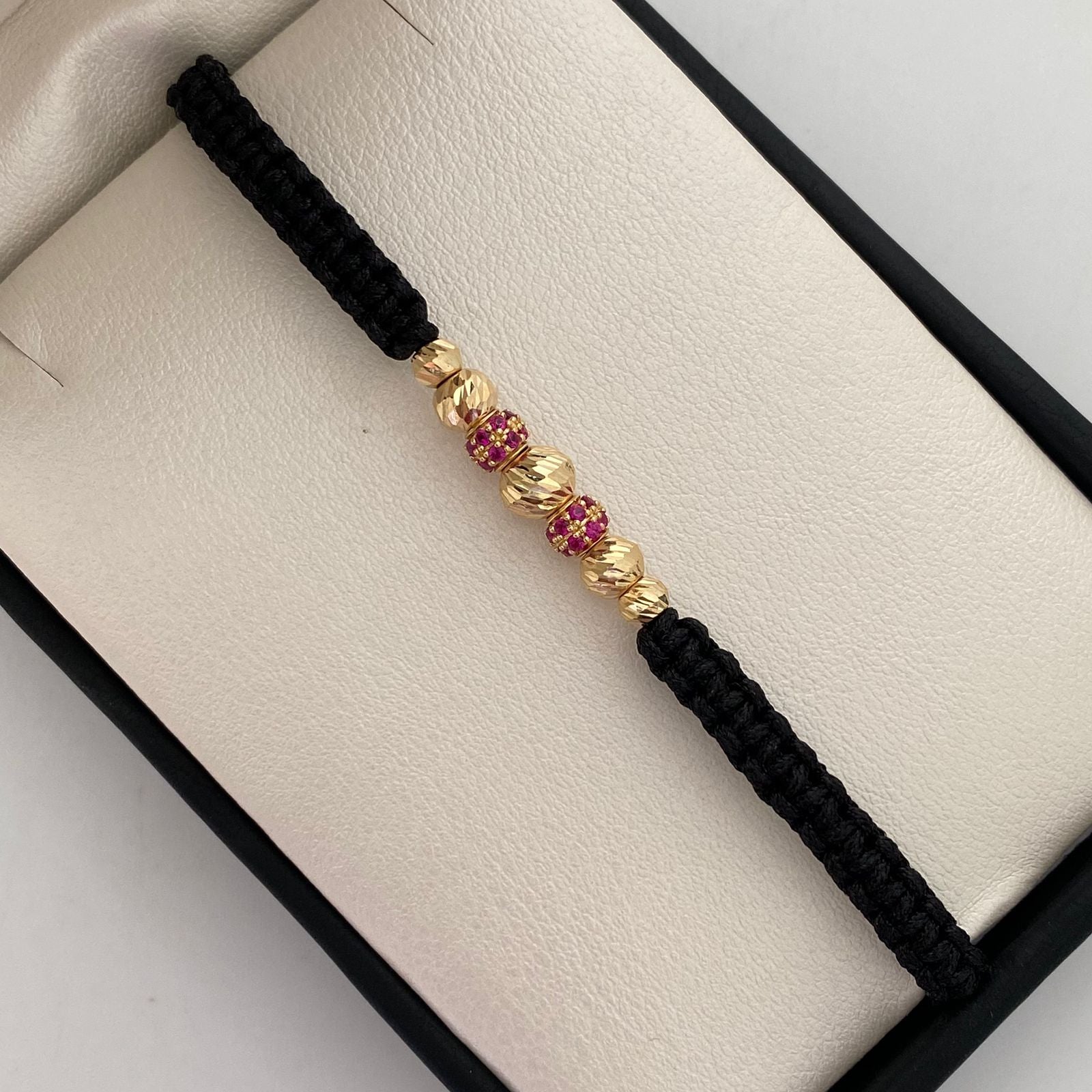 Pulsera tejida Bolas de fuego casting rosada bolas diamantadas 5,6 y 4mm Oro amarillo 18k 1,05 Gr