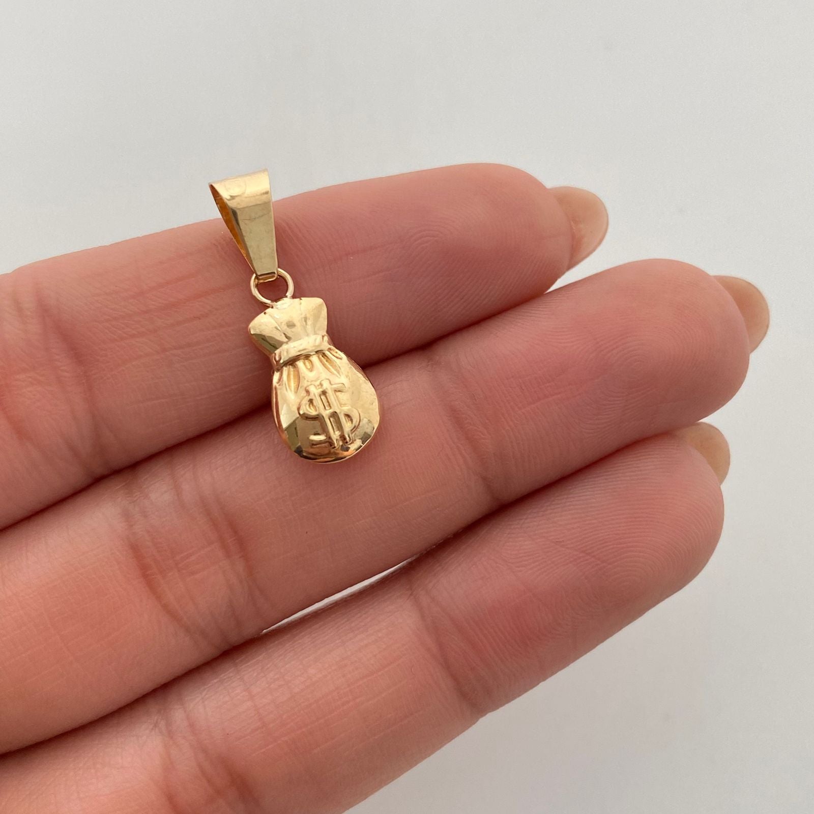 Dije bolsa de dinero  Oro amarillo 18k 0,75 Gr / 8,1 mm / 2,1 Cm
