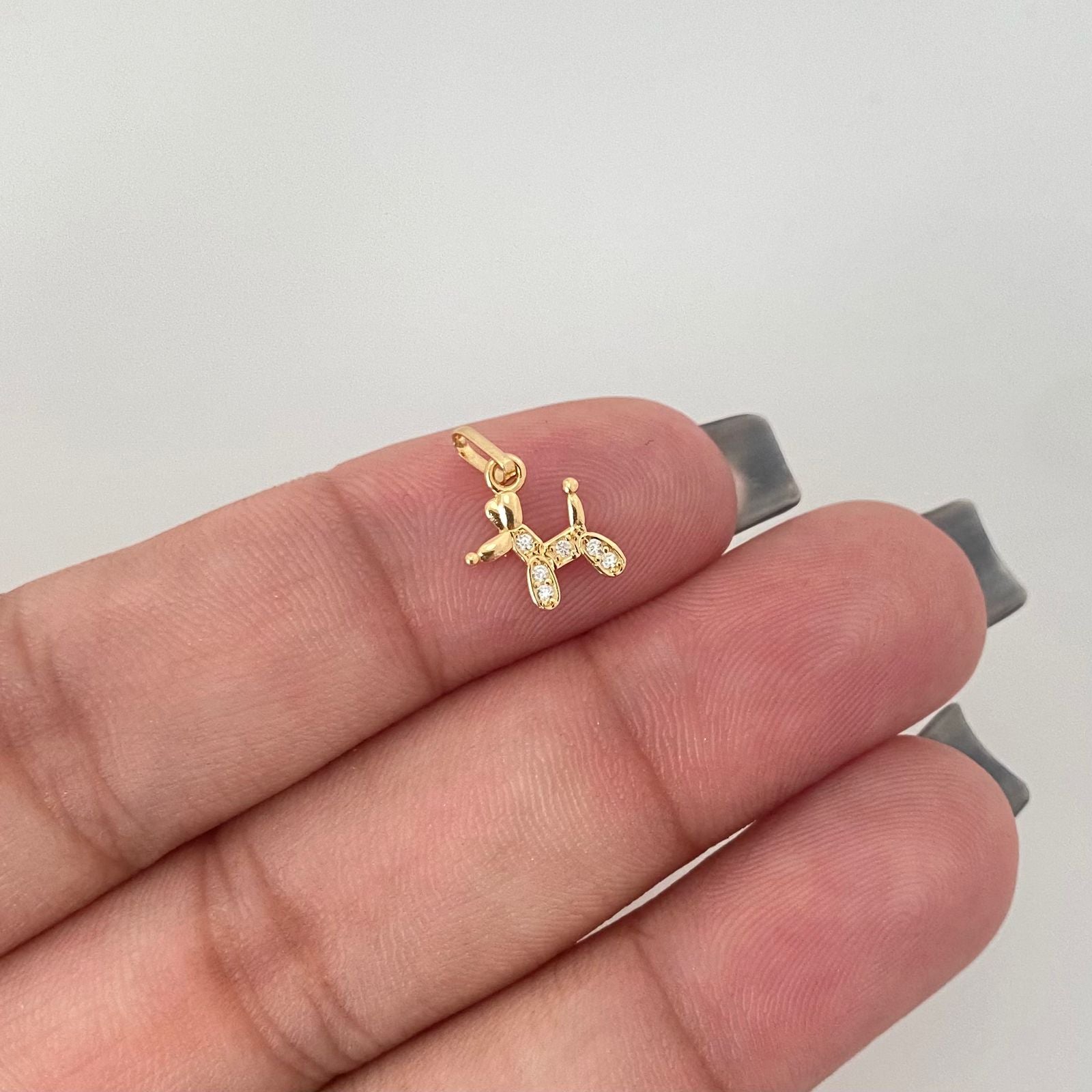 Dije perrito globo casting Oro amarillo 18k 0,45 Gr / 1,5 Cm