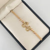 Pulsera tejida con herraje de bicileta y balines diamantados #3 y #4  Oro amarillo y Oro blanco 18k 2,75 Gr