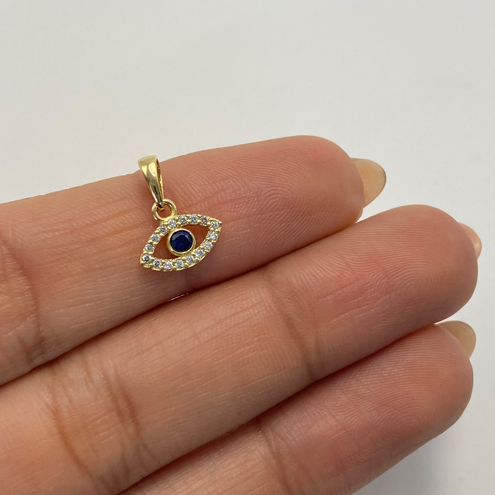 Dije Ojo turco circon azul Oro amarillo 18k 0,6 Gr / 9,8 mm / 1,3 Cm