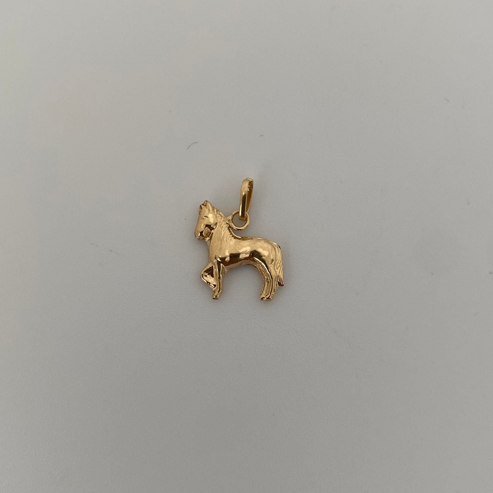 Dije caballo  Oro amarillo 18k 0,55 Gr / 1,5 Cm