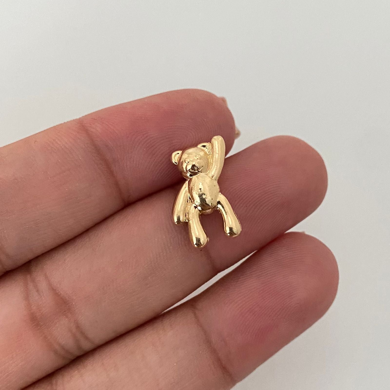 Dije oso mano alzada Oro amarillo 18k 0,95 Gr / 1,4 Cm