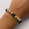 Pulsera tejida Bolas diamantadas 8mm y neoros una raya 8mm Tres oros 18k 1,3 Gr