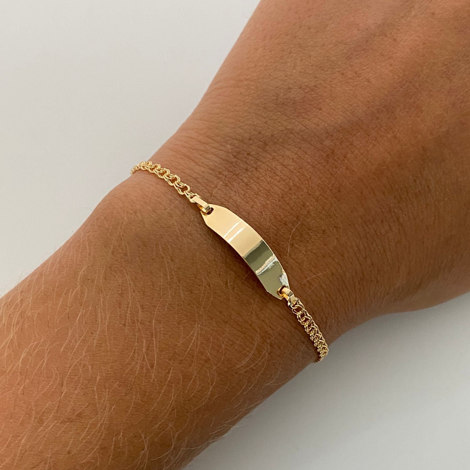 Pulso bebé aro seguido placa semi rectangular  Oro amarillo 18k 1,45 Gr / 5,3 mm / 15 Cm Broche 0,15