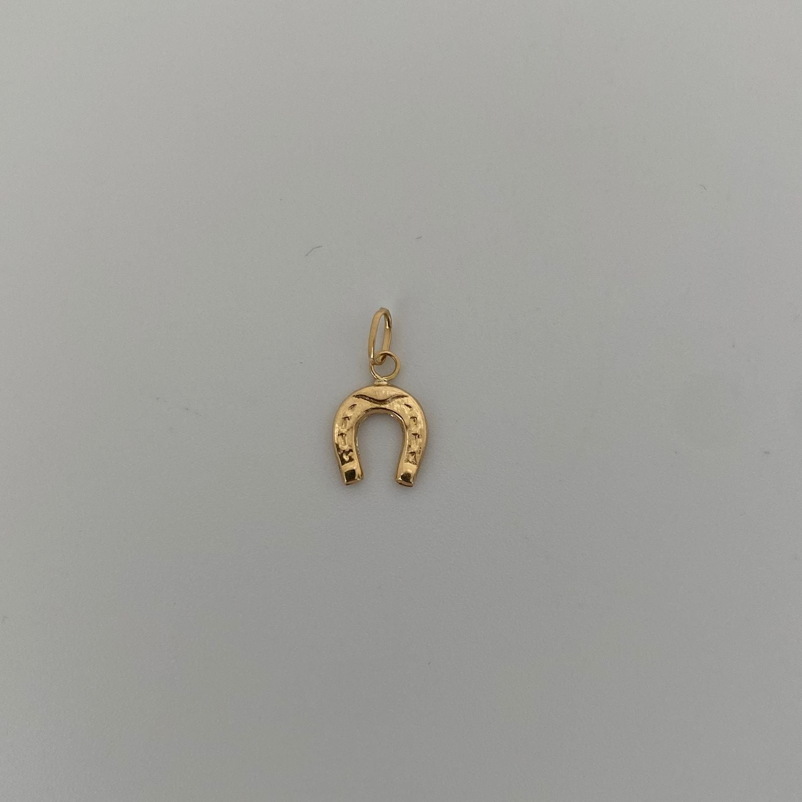 Dije herradura  Oro amarillo 18k 0,3 Gr / 1,5 Cm