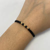 Pulsera tejida Bola 3mm hilo negro Oro amarillo 18k 0,2 Gr