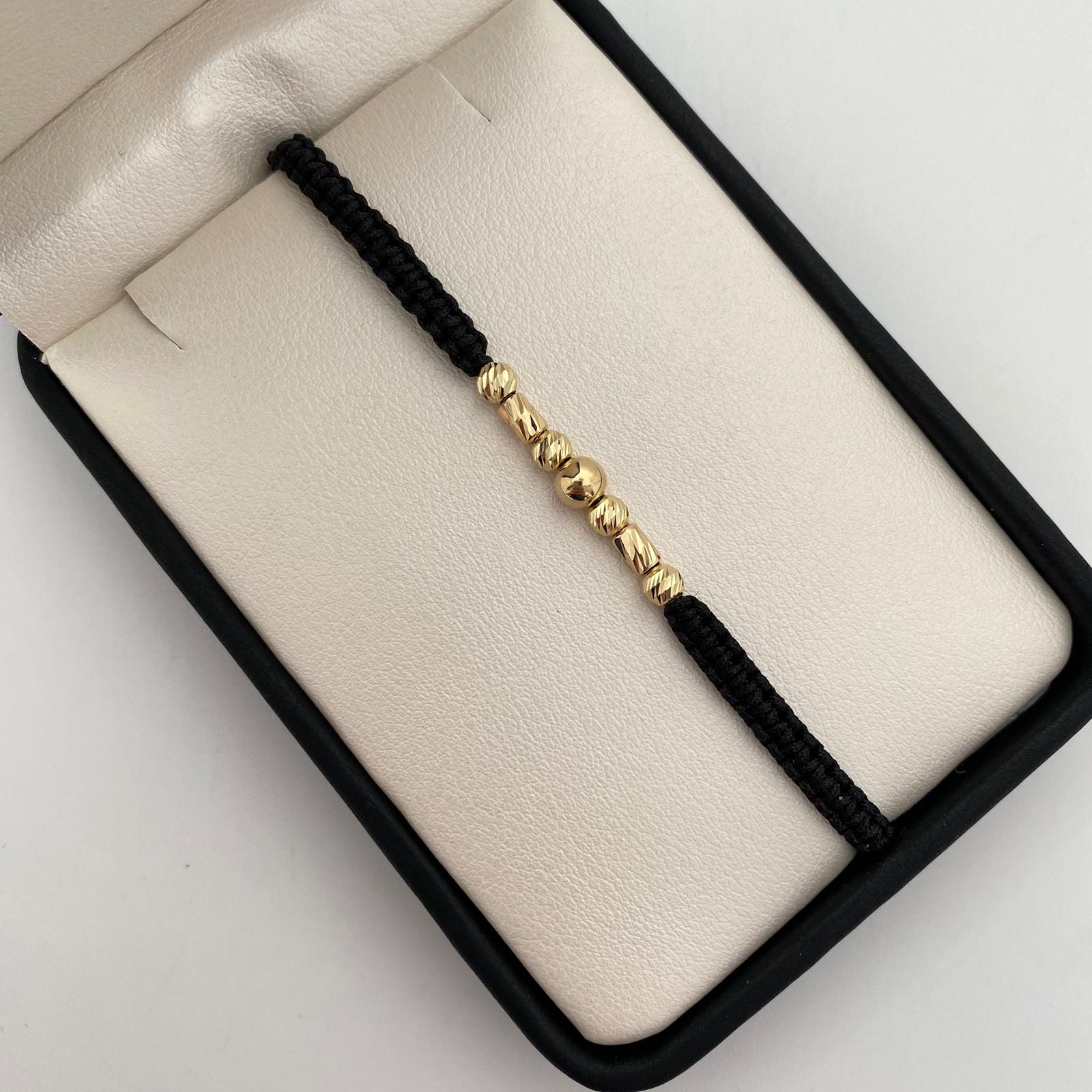 Pulsera tejida con cilindros y balines diamantados y lisos 5mm y 4mm  Oro amarillo 18k 0,75 Gr
