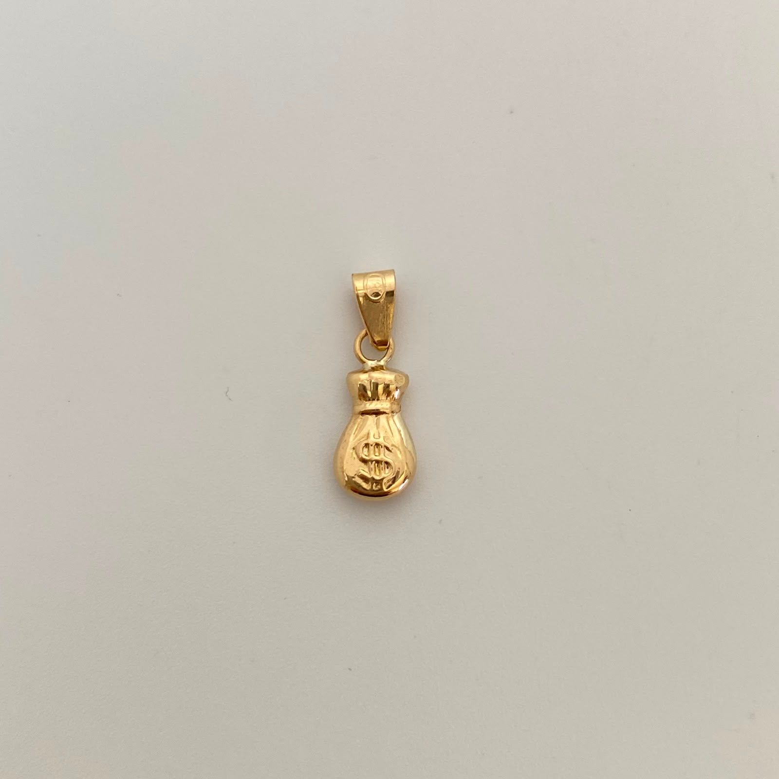 Dije Bolsa de Valores Oro amarillo 18k 0,55 Gr / 7,7 mm / 2 Cm