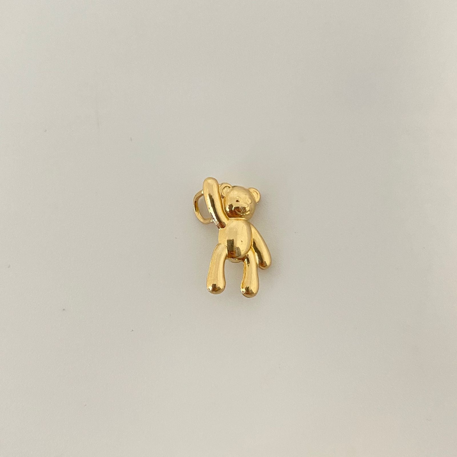 Dije oso mano alzada Oro amarillo 18k 0,9 Gr / 1,5 Cm