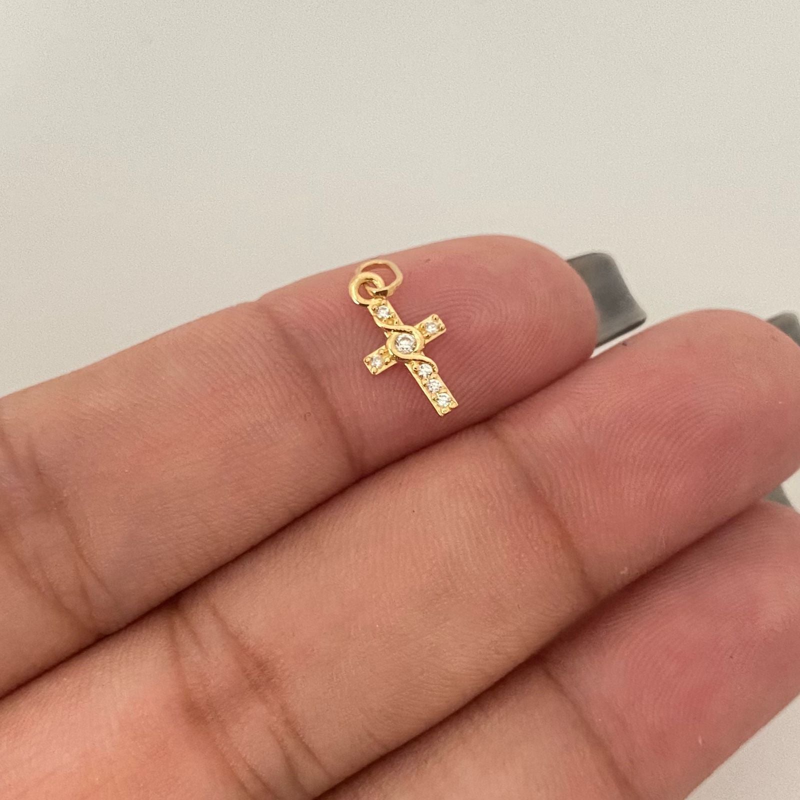 Dije mini cruz centro lazo Oro amarillo 18k 0,40 Gr / 1,5 Cm