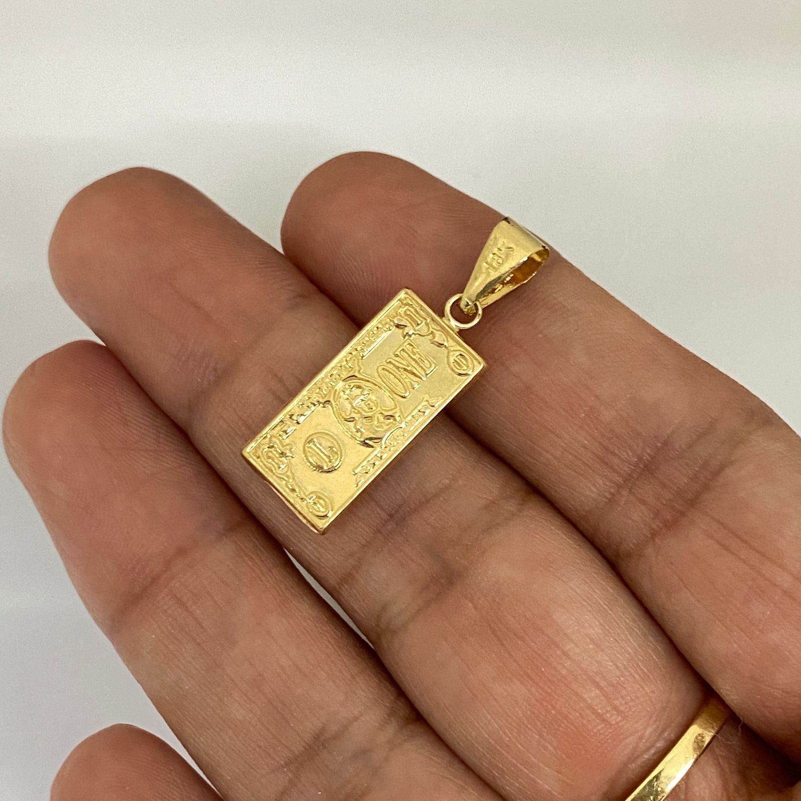 Dije dolar Oro amarillo 18k 1,25 Gr / 2,7 Cm