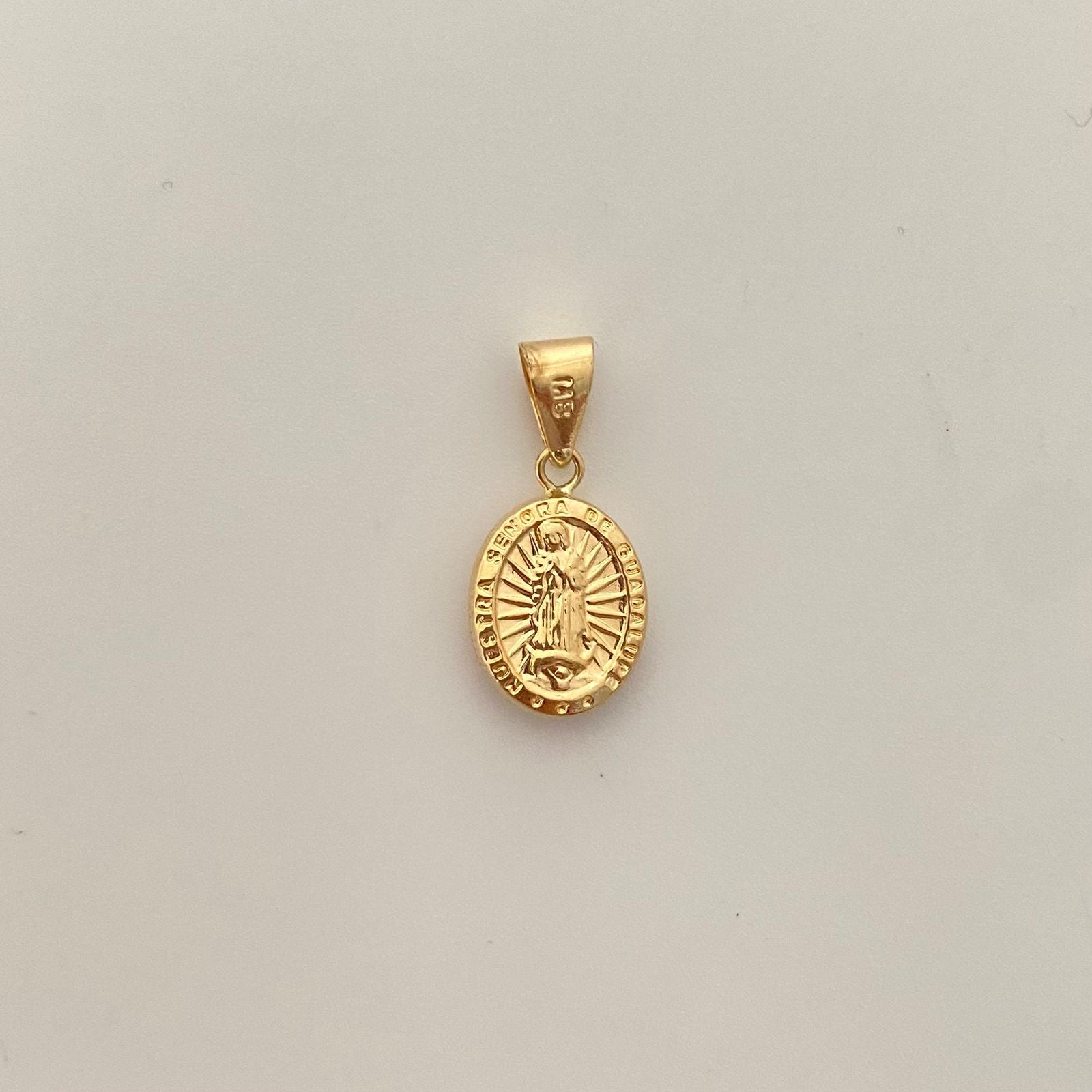 Dije virgen guadalupe troquel Oro amarillo 18k 0,95 Gr / 2,2 Cm
