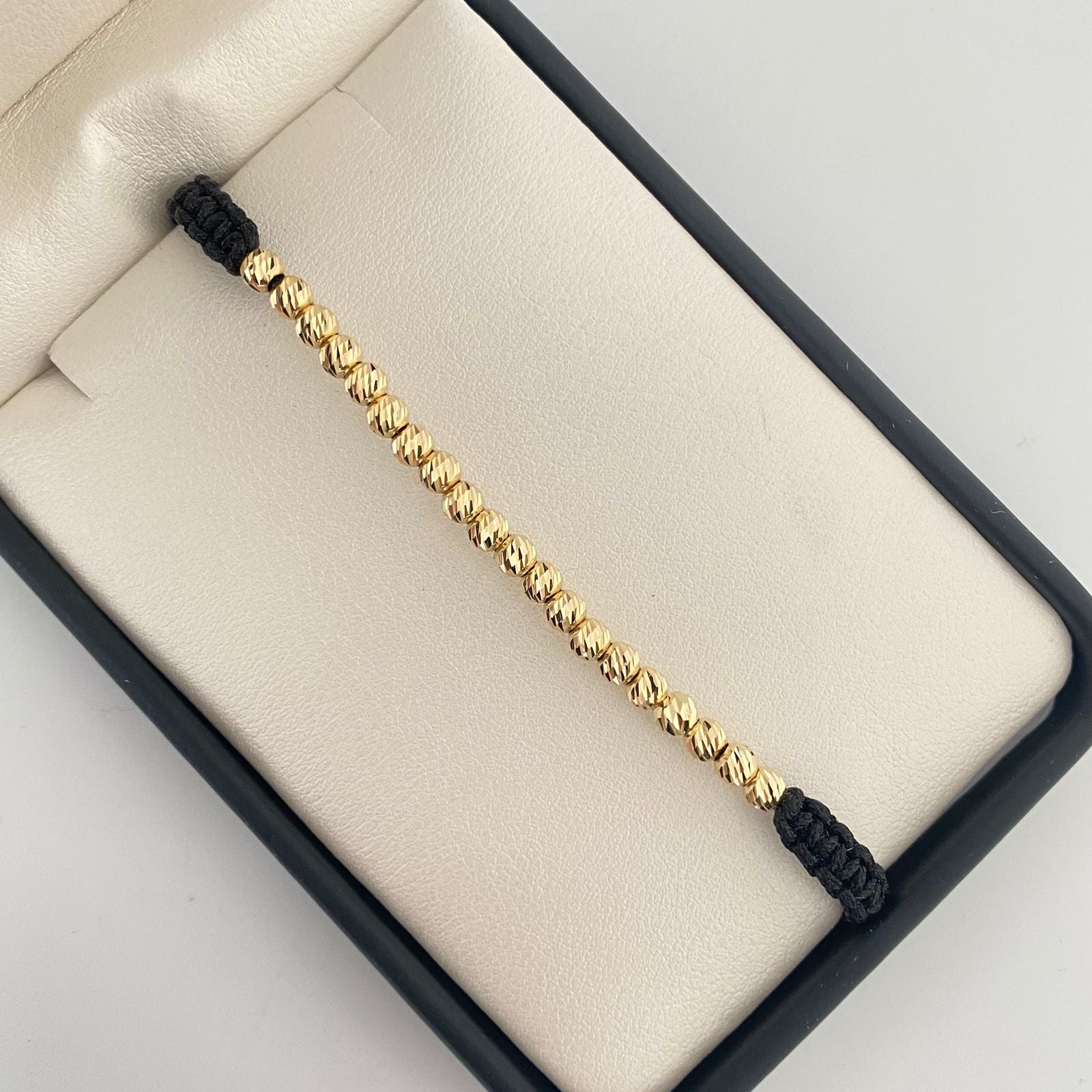 Pulsera tejida con balines diamantados #4 y punteras #3 Oro amarillo 18k 1,95 Gr
