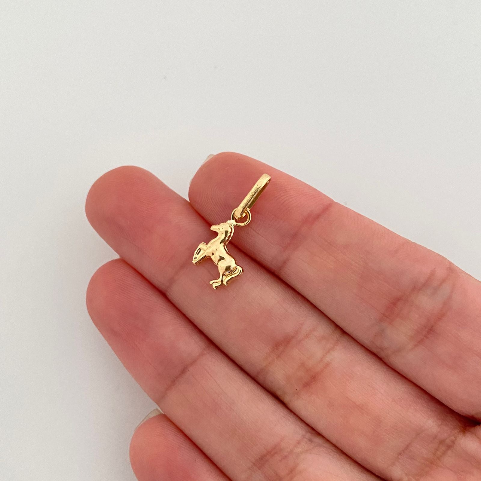 Dije caballo mini Oro amarillo 18k 0,55 Gr / 1,80 Cm