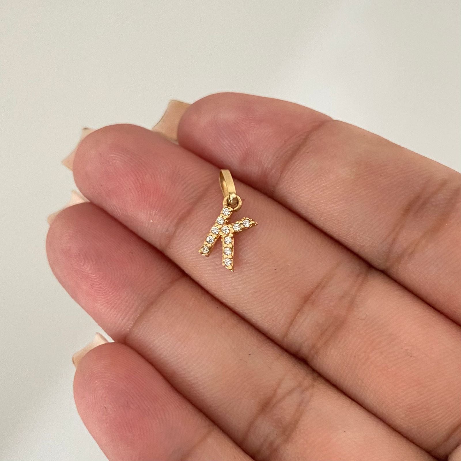 Dije letra K casting Oro amarillo 18k 0,5 Gr / 1,5 Cm