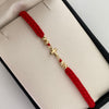 Pulsera tejida Herraje cruz bola diamantada 4mm Hilo rojo Oro amarillo 18k 0,6 Gr