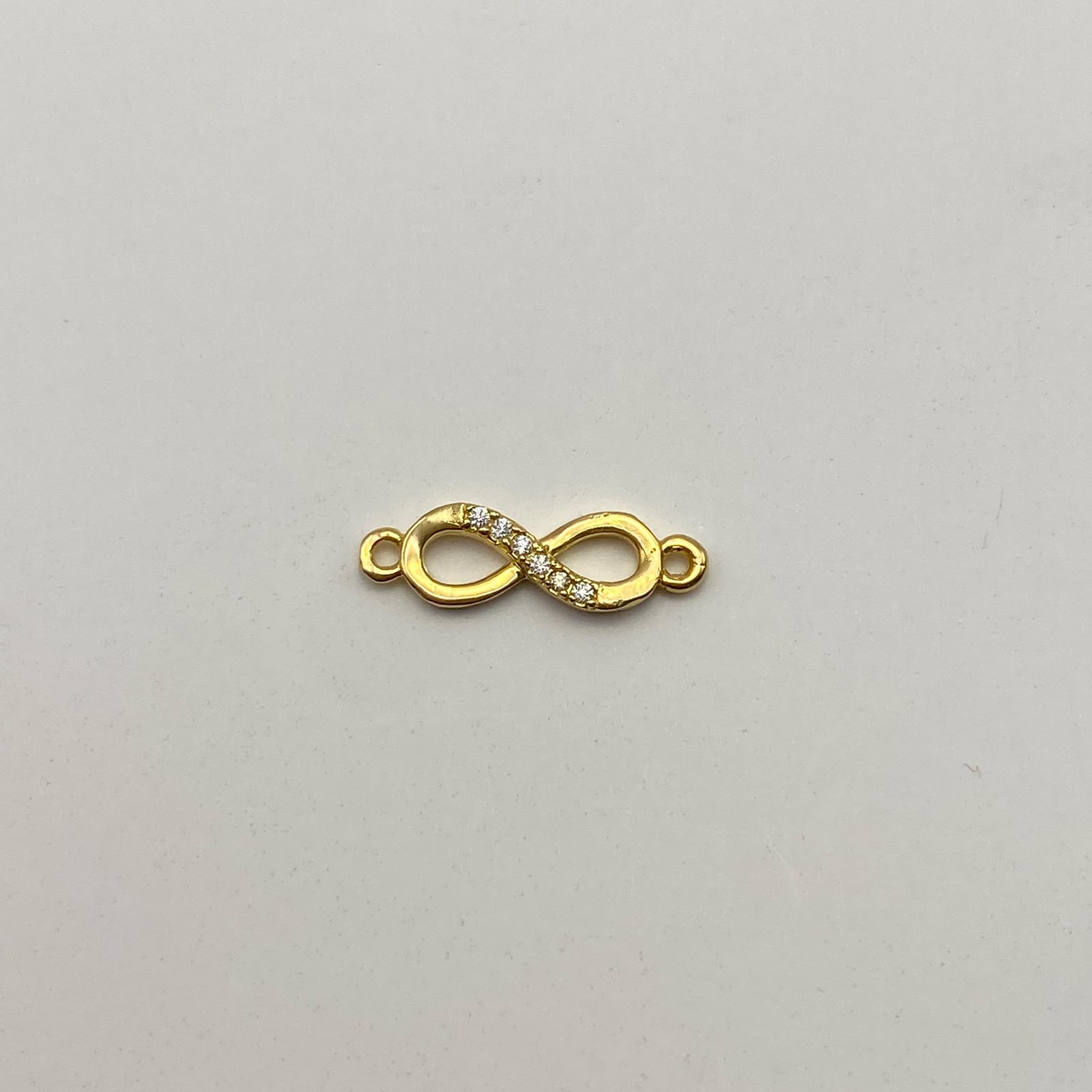Herraje Infinito casting  Oro amarillo 18k 0,85 Gr / 1,8 Cm