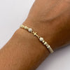 Pulsera tejida Herraje cruz lisa bolas diamantadas 4mm hilo beige  Oro amarillo 18k 0,45 Gr
