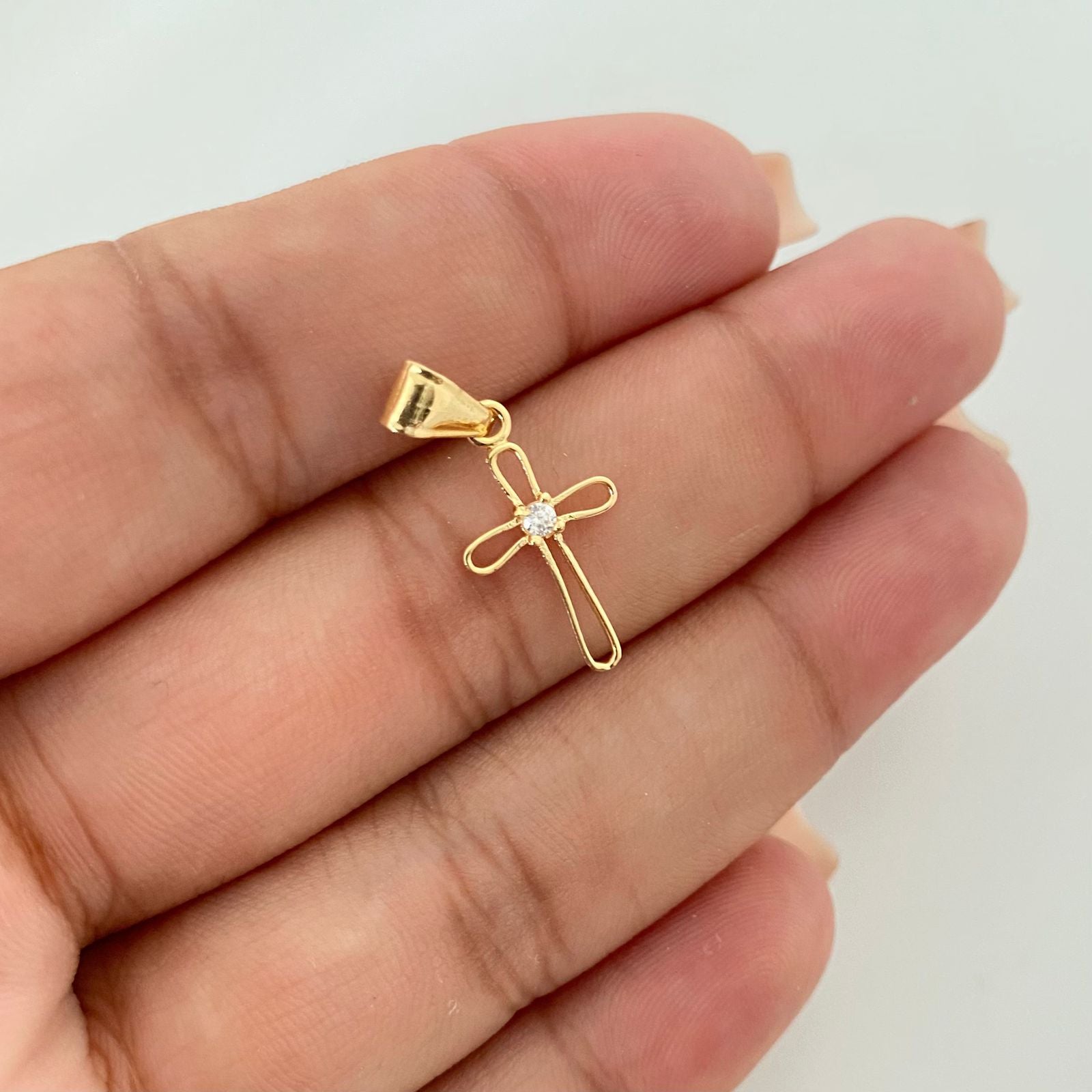 Dije silueta cruz centro circon Oro amarillo 18k 0,5 Gr / 2,4 Cm