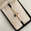 Pulsera tejida con herraje de pato y balines diamantados  Tres oros 18k 3,05 Gr