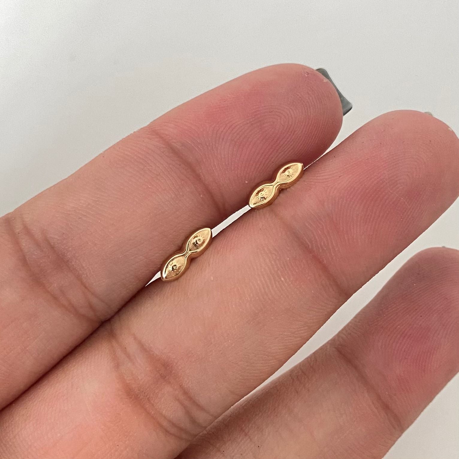 Topos ojos de santa lucía Oro amarillo 18k 0,50 Gr / 8,7 mm