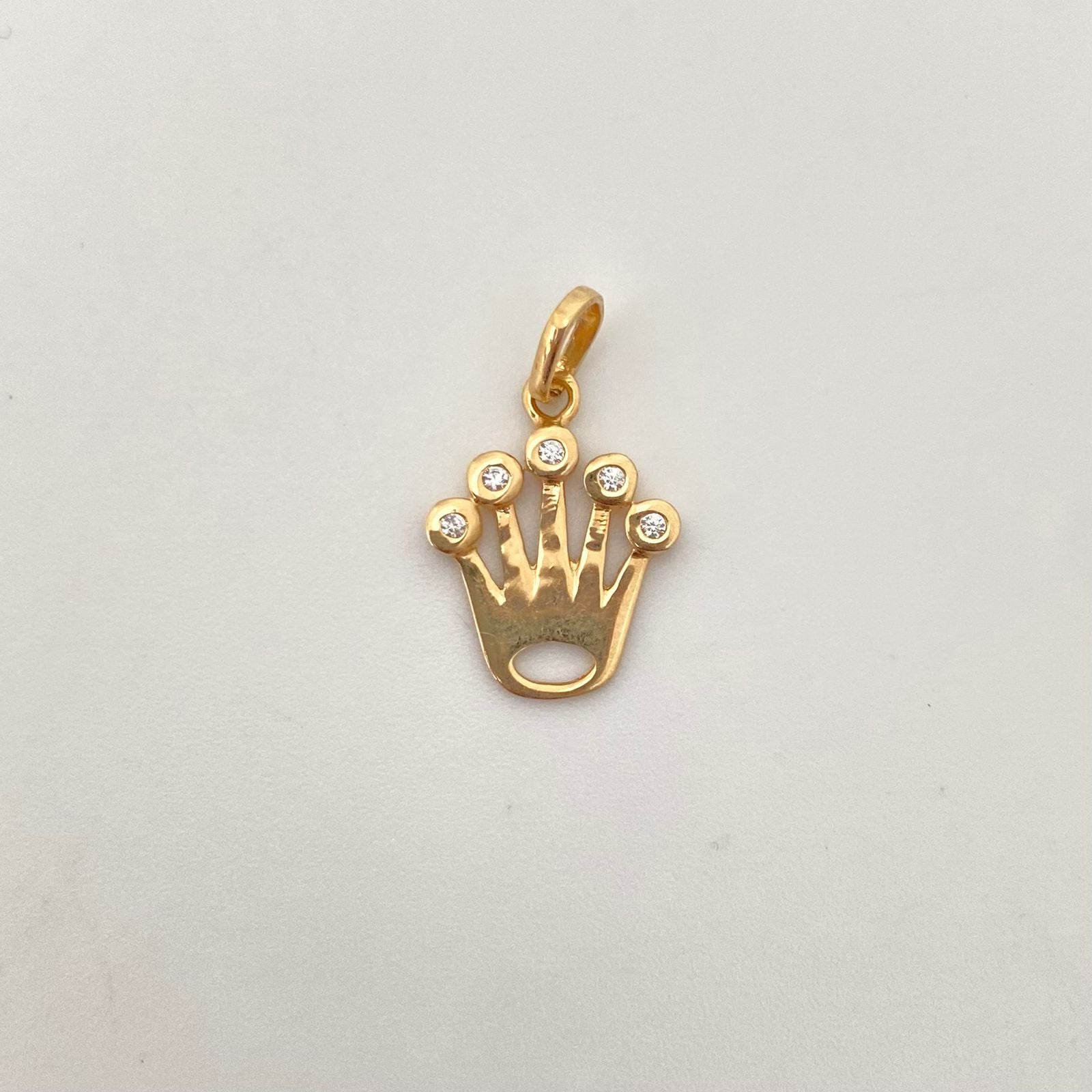 Dije silueta corona rx casting Oro amarillo 18k 1,3 Gr / 2,0 Cm