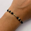 Pulsera tejida Herraje cruz lisa bolas diamantadas 4mm hilo negro Oro amarillo 18k 0,45 Gr
