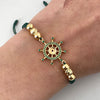 Pulsera tejida con herraje de timon con circones verdes  Oro amarillo 18k 3,1 Gr