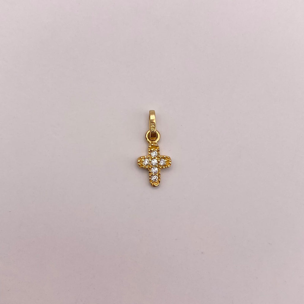 Dije mini cruz ovalada circones blancos Oro amarillo 18k 0,45 Gr / 6,35 mm / 1,3 Cm