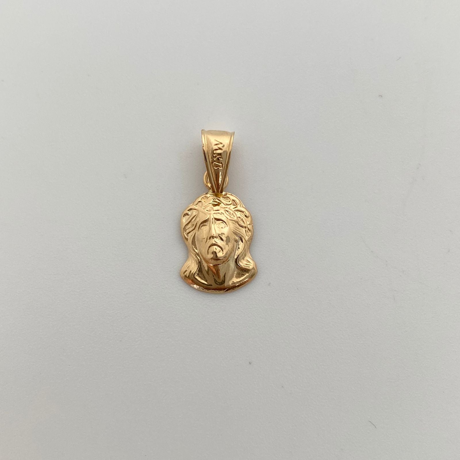 Dije Rostro Oro amarillo 18k 0,65 Gr / 9,4 mm / 2 Cm