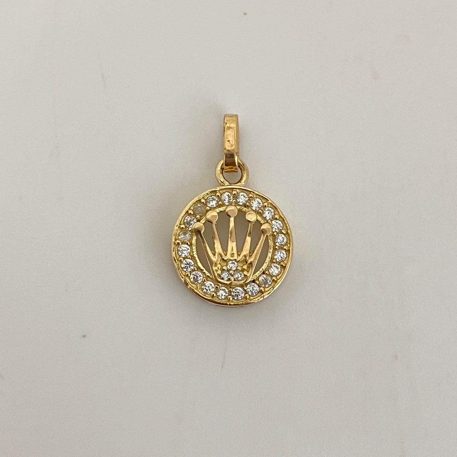 Dije rx con circon blanco  Oro amarillo 18k 2,1 Gr / 12,5 mm / 2 Cm