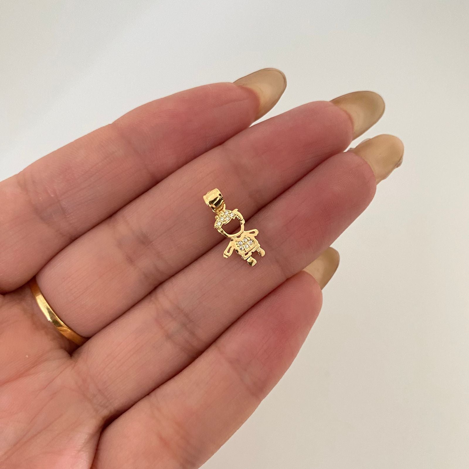 Dije silueta niño casting Oro amarillo 18k 0,55 Gr / 1,8 Cm