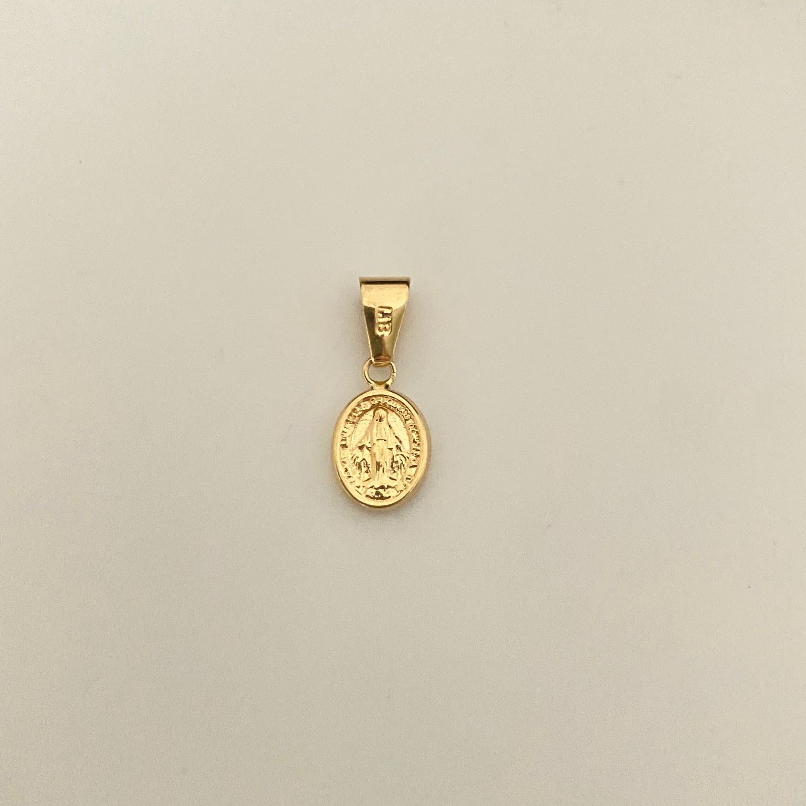 Dije virgen milagrosa Oro amarillo 18k 0,6 Gr / 1,8 Cm