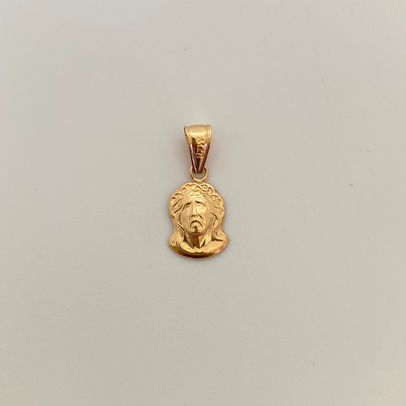 Dije Rostro Oro amarillo 18k 0,65 Gr / 9,5 mm / 2 Cm