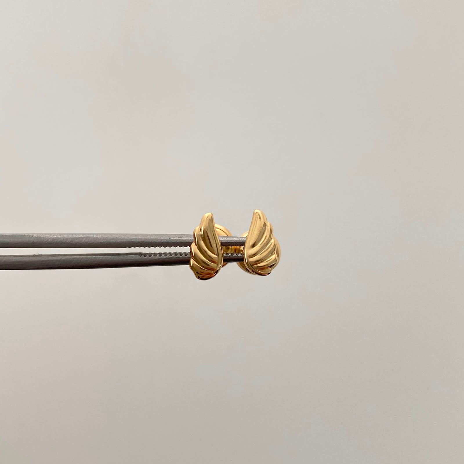 Topos Alas  Oro amarillo 18k 0,6 Gr / 4 mm