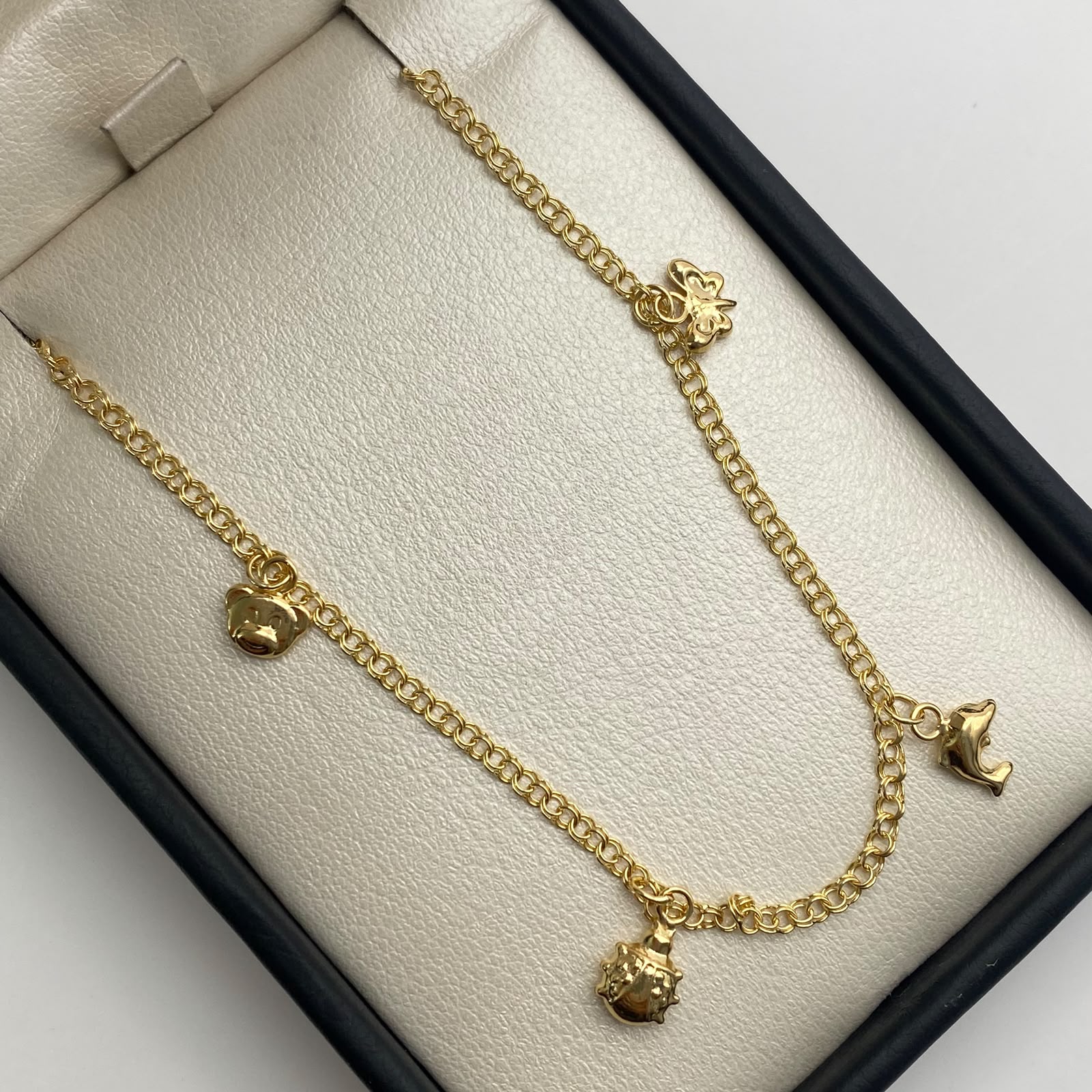 Tobillera aro seguido dijes Oro amarillo 18k 3,80 Gr / 2,25 mm / 24,5 Cm Broche 0,40