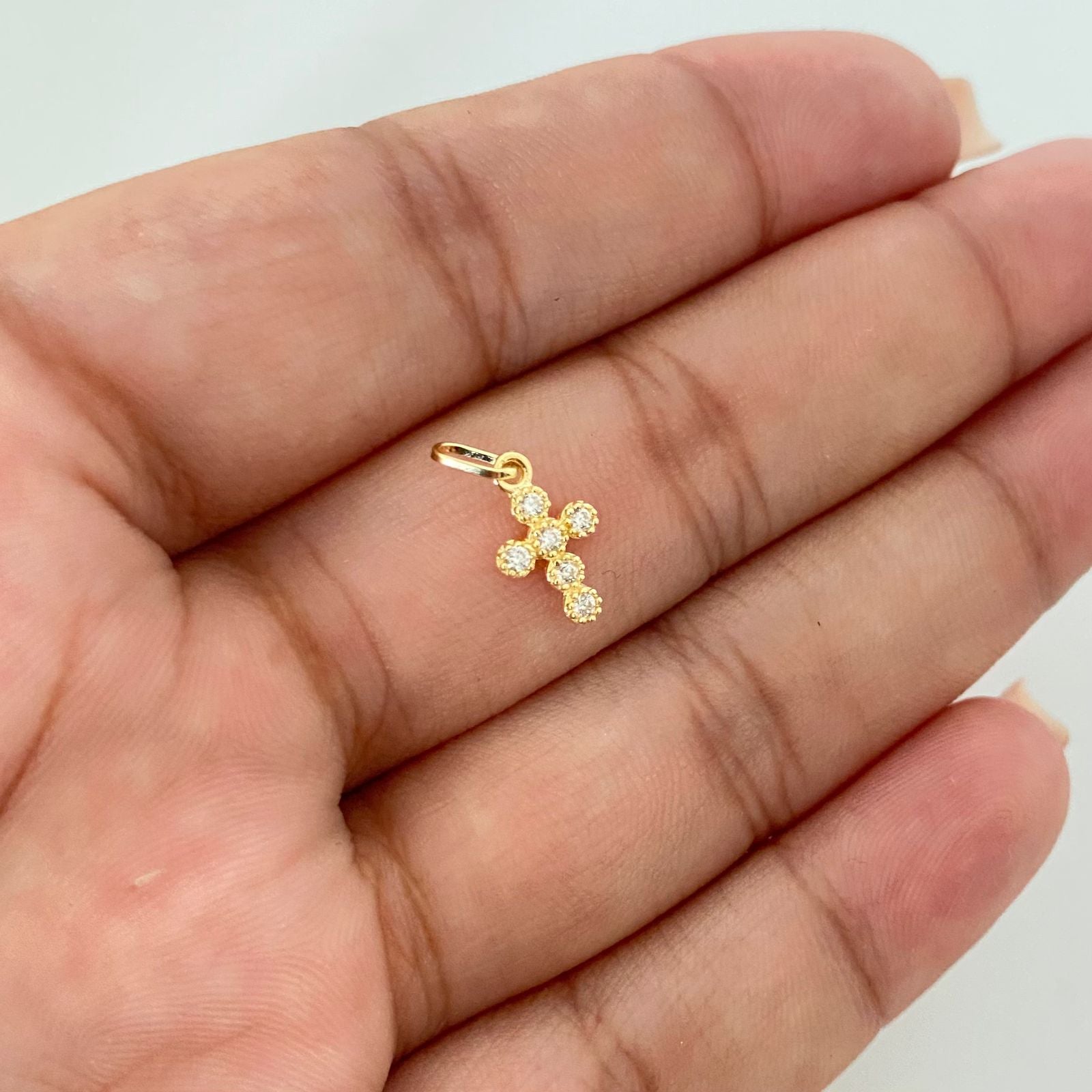 Dije cruz mini bolitas punteada casting Oro amarillo 18k 0,45 Gr / 1,5 Cm