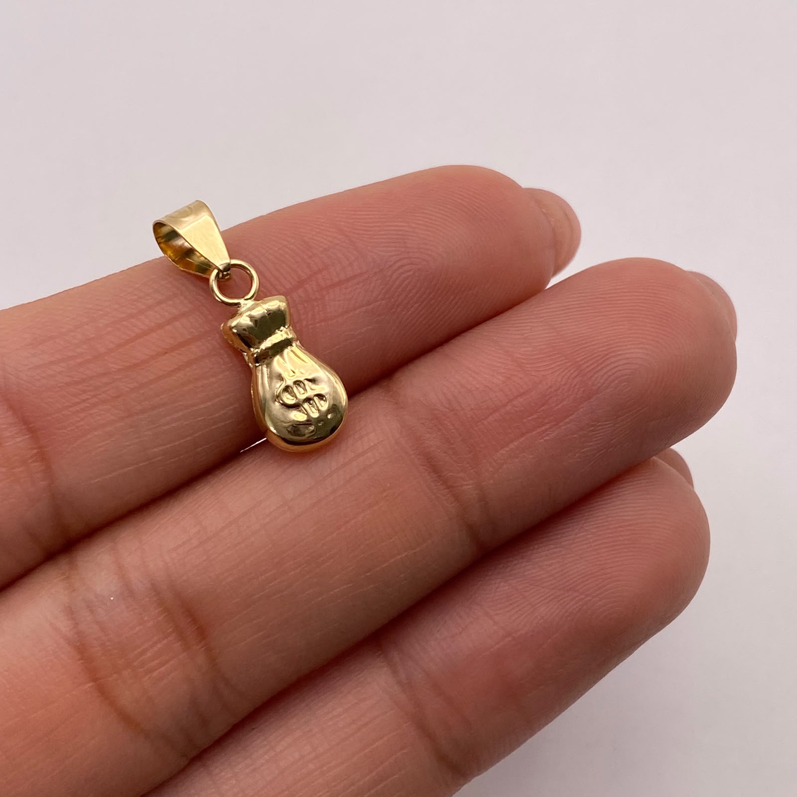 Dije Bolsa de valores Oro amarillo 18k 0,53 Gr / 6,5 mm / 2 Cm