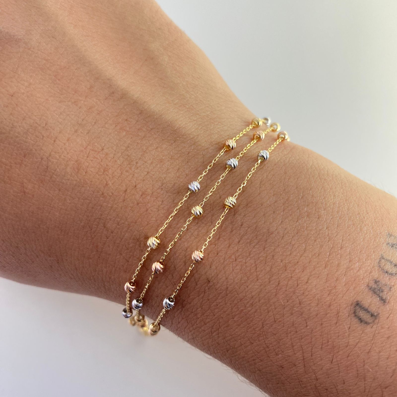 Pulso It aro seguido balines diamantados Tres oros 18k +3 / 3,2 Gr / 2,55 mm / 18 Cm