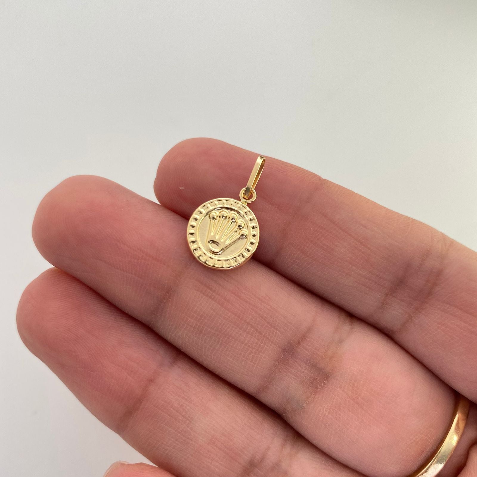 Dije corona rx borde punteado Oro amarillo 18k 0,55 Gr / 1,8 Cm