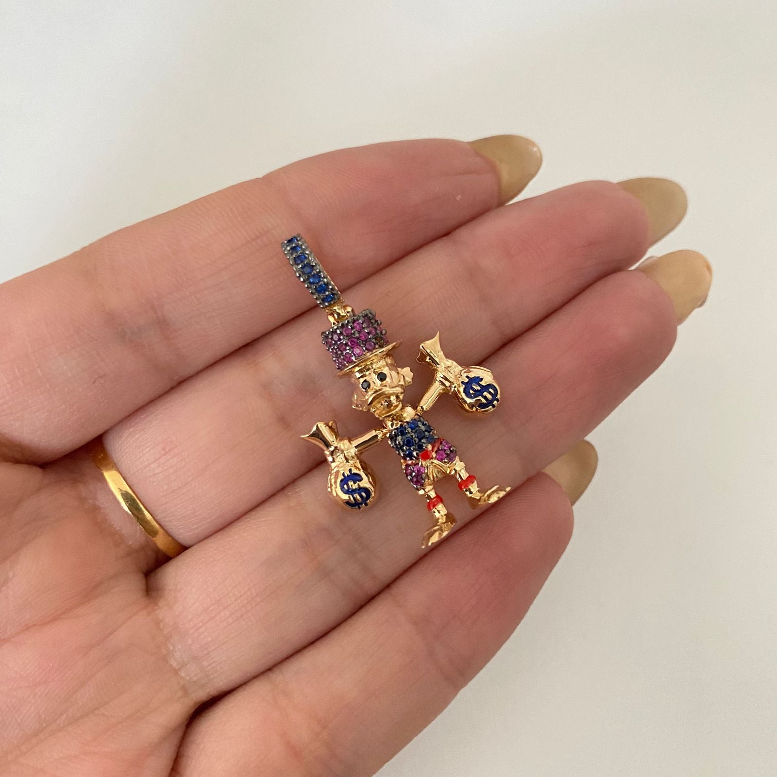 Dije tio rico casting Oro amarillo 18k 4,45 Gr / 3,5 Cm