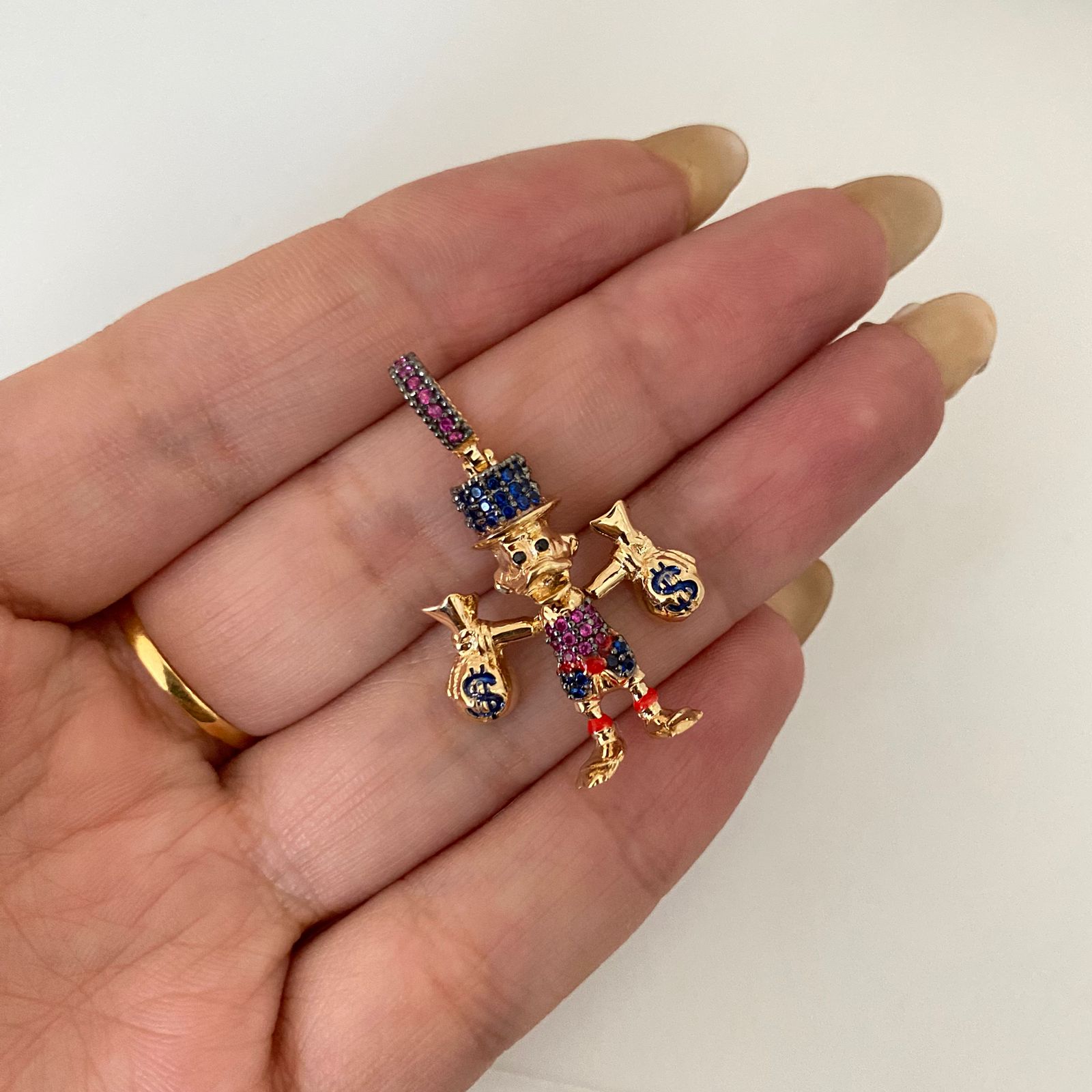 Dije tio rico casting Oro amarillo 18k 4,7 Gr / 3,5 Cm