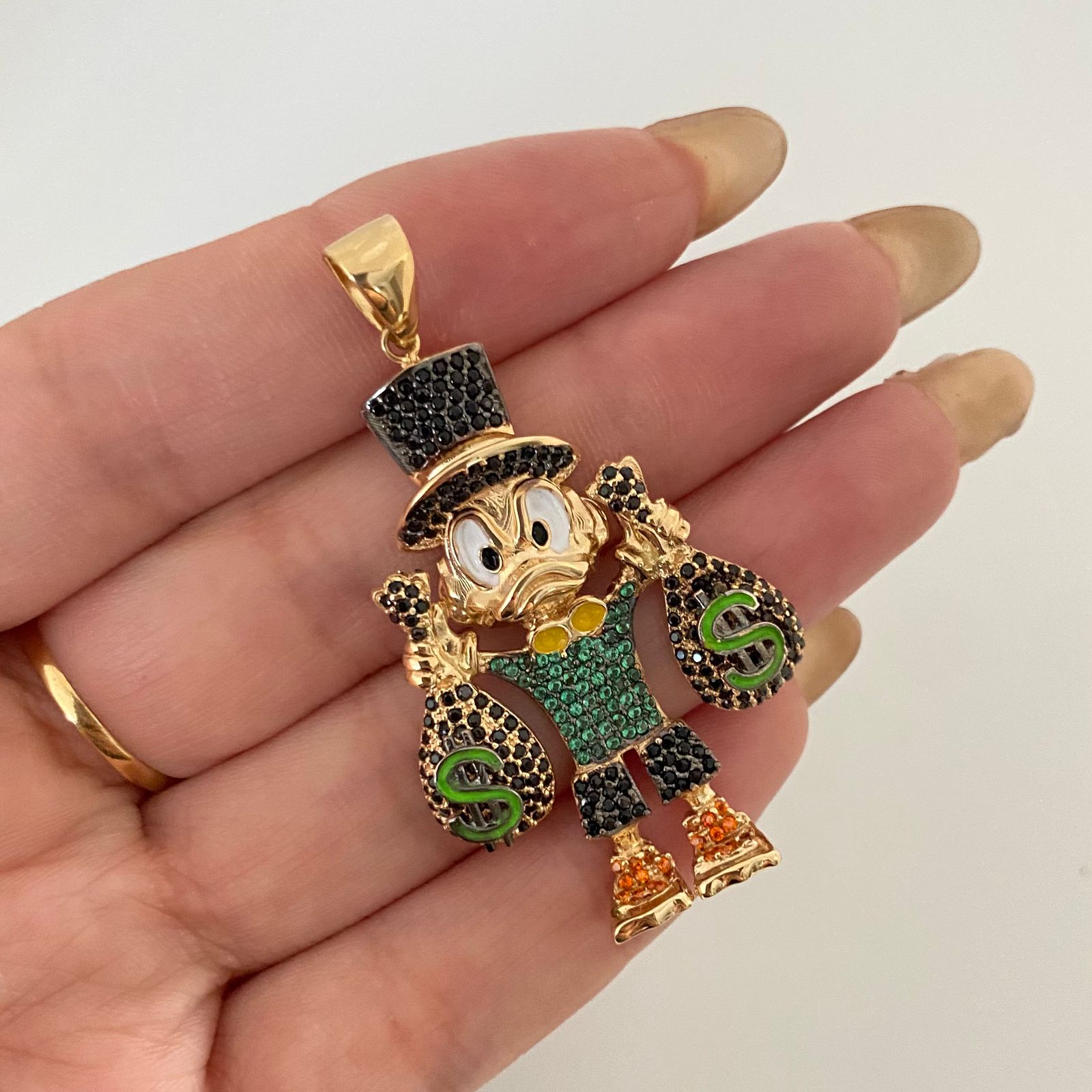 Dije tio rico casting Oro amarillo 18k 12,5 Gr / 5,5 Cm