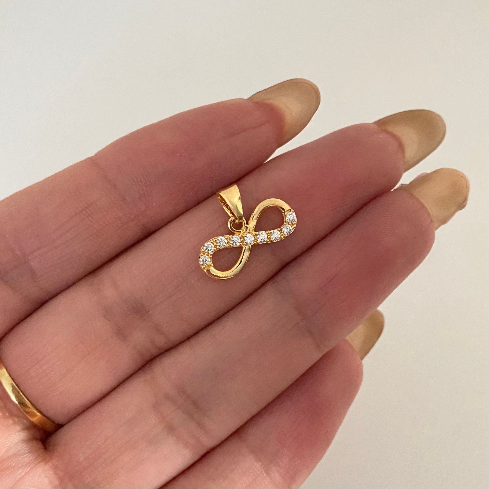 Dije infinito liso y casting Oro amarillo 18k 0,85 Gr / 1,0 Cm