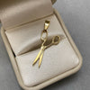 Dije tijera lisa (POR FABRICACION) Oro amarillo 18k 3,05 Gr / 3,0 Cm