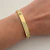 Pulso It cubano con placa y broche con circones blancos  Oro amarillo 18k +4 / 12,35 Gr / 6,6 mm / 20,5 Cm