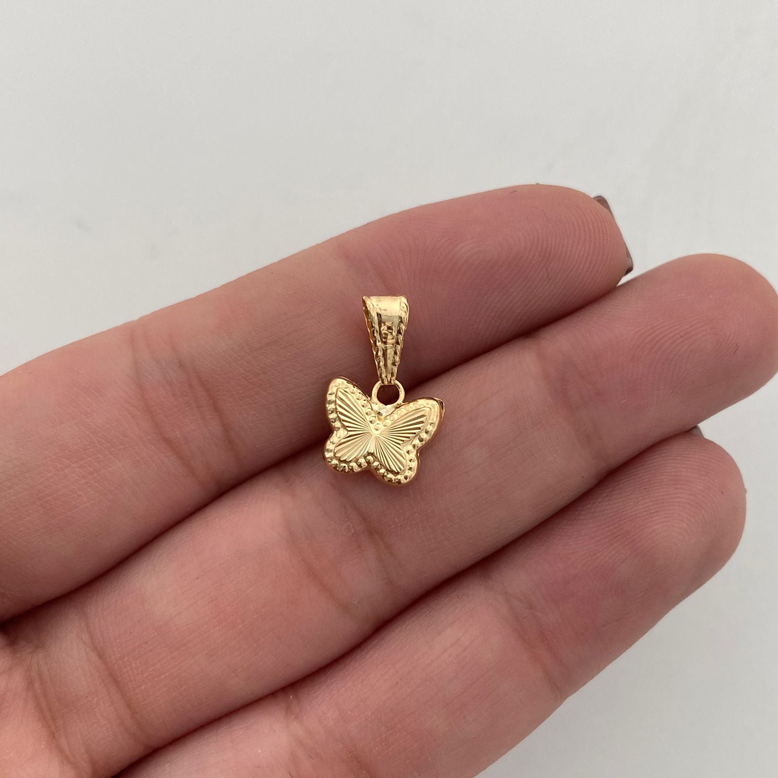Dije Mariposa Diamantada Oro amarillo 18k 0,45 Gr / 9,9 mm / 1,5 Cm