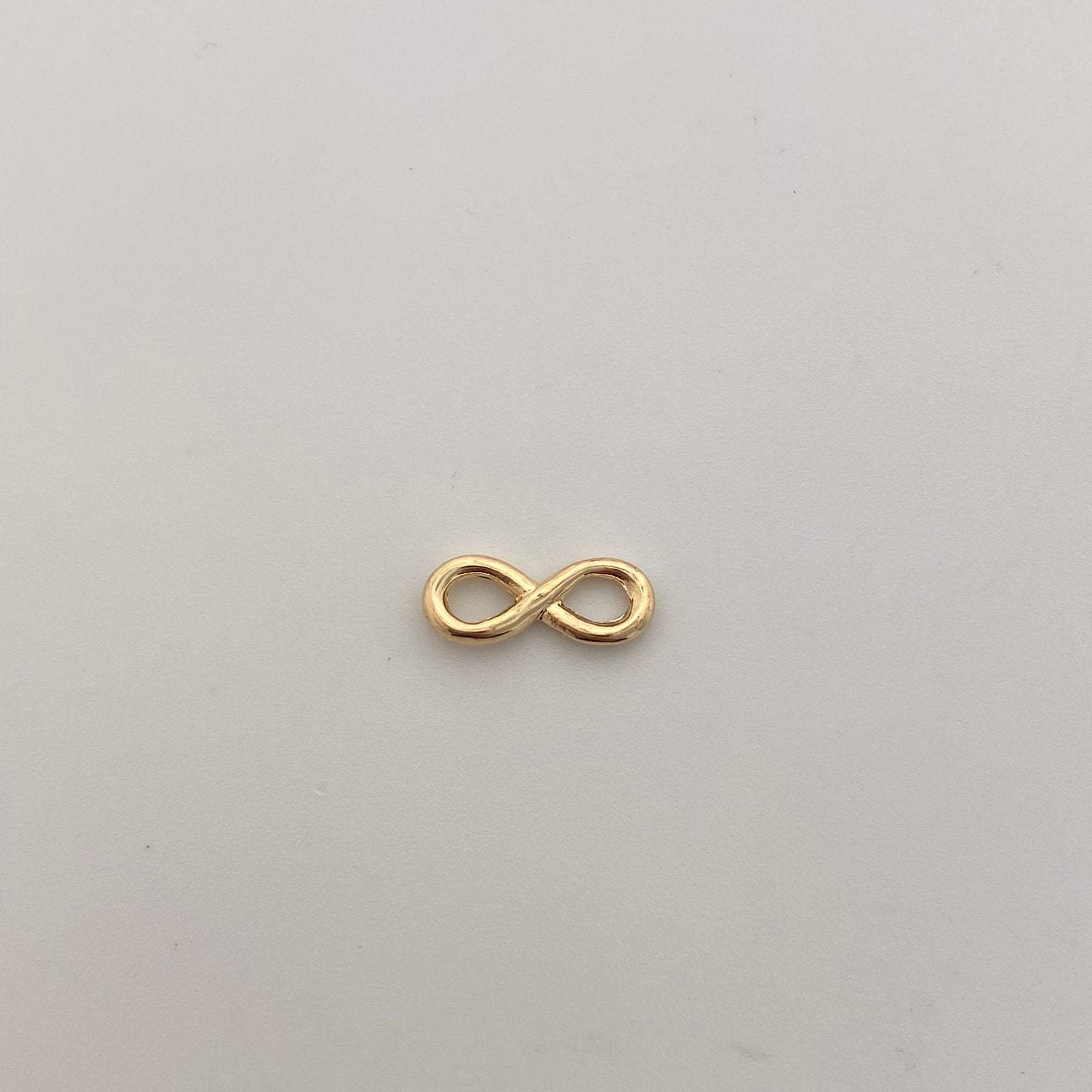 Herraje Infinito mediano Oro amarillo 18k 0,45 Gr / 0,5 Cm