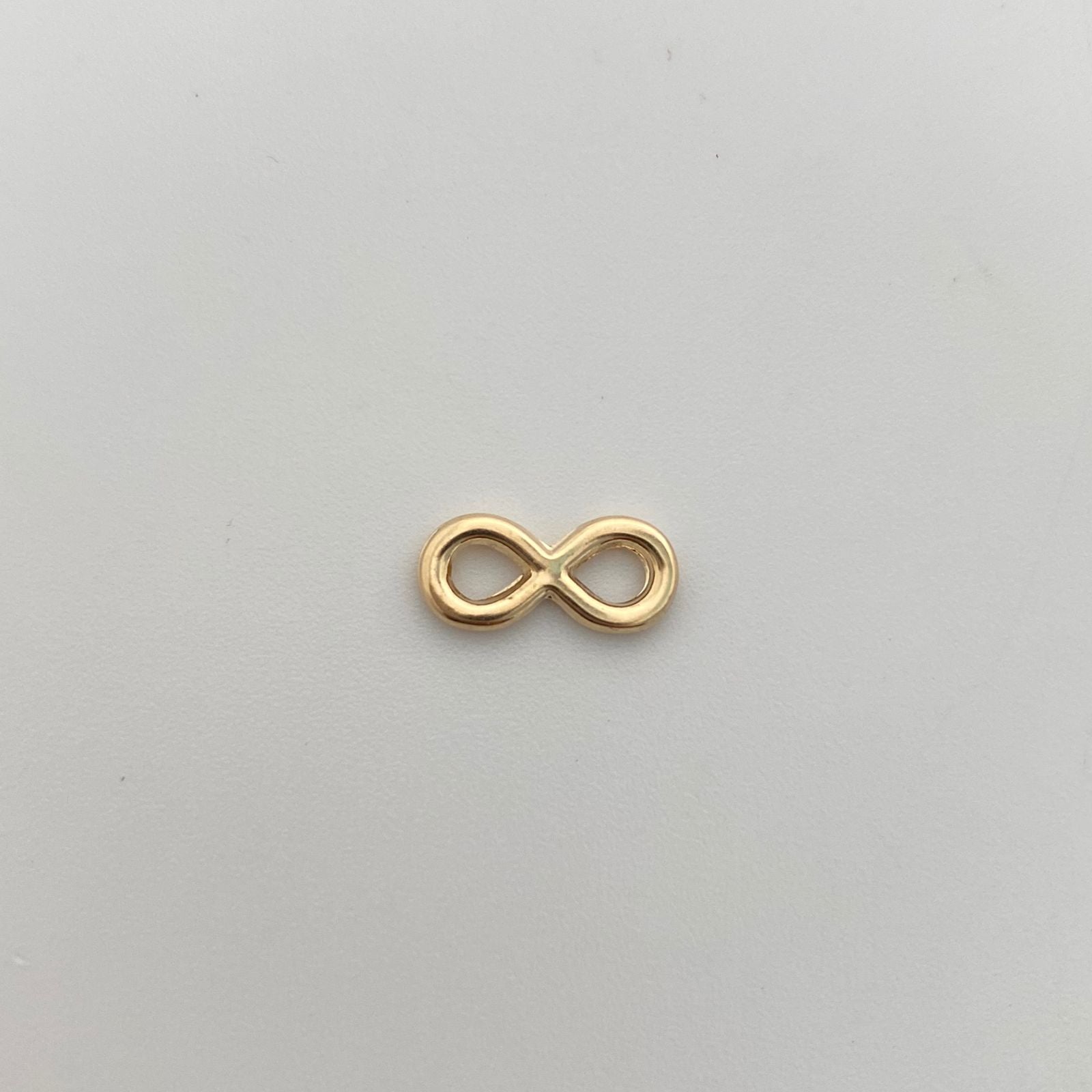 Herraje Infinito pequeño Oro amarillo 18k 0,35 Gr / 0,5 Cm